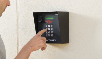 Keypad_entry person entering PIN on Sentinel keypad at Fort Knox Self Storage entrance